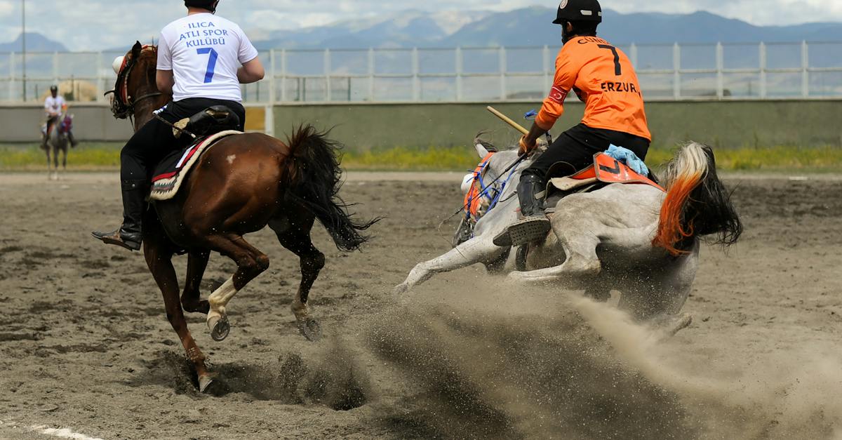 two-men-in-protective-helmets-racing-at-a-jareed-competition